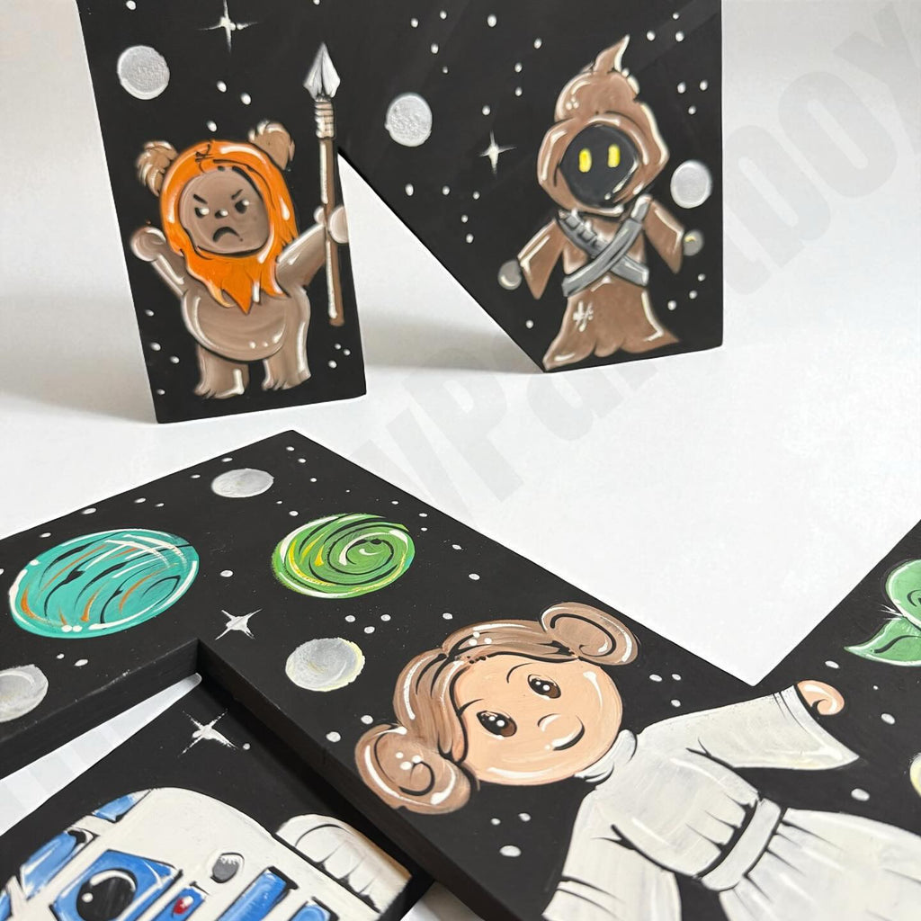 Set of Star Wars-themed wooden letters with characters and space design.
