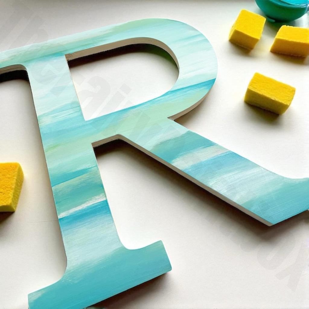 Large blue letter 'R' with yellow blocks on a white background